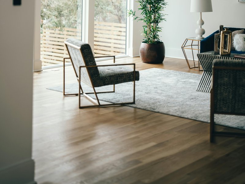 Open-plan living area with premium flooring installation and contemporary design finishes in Frisco CO