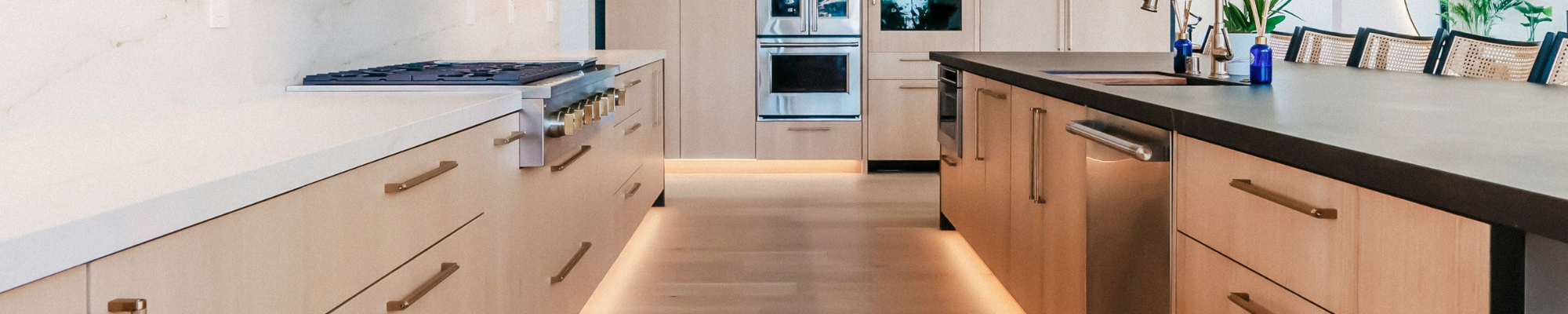 Family-owned flooring business team at All Flooring Design showroom in Frisco Colorado helping customers choose hardwood and carpet flooring samples